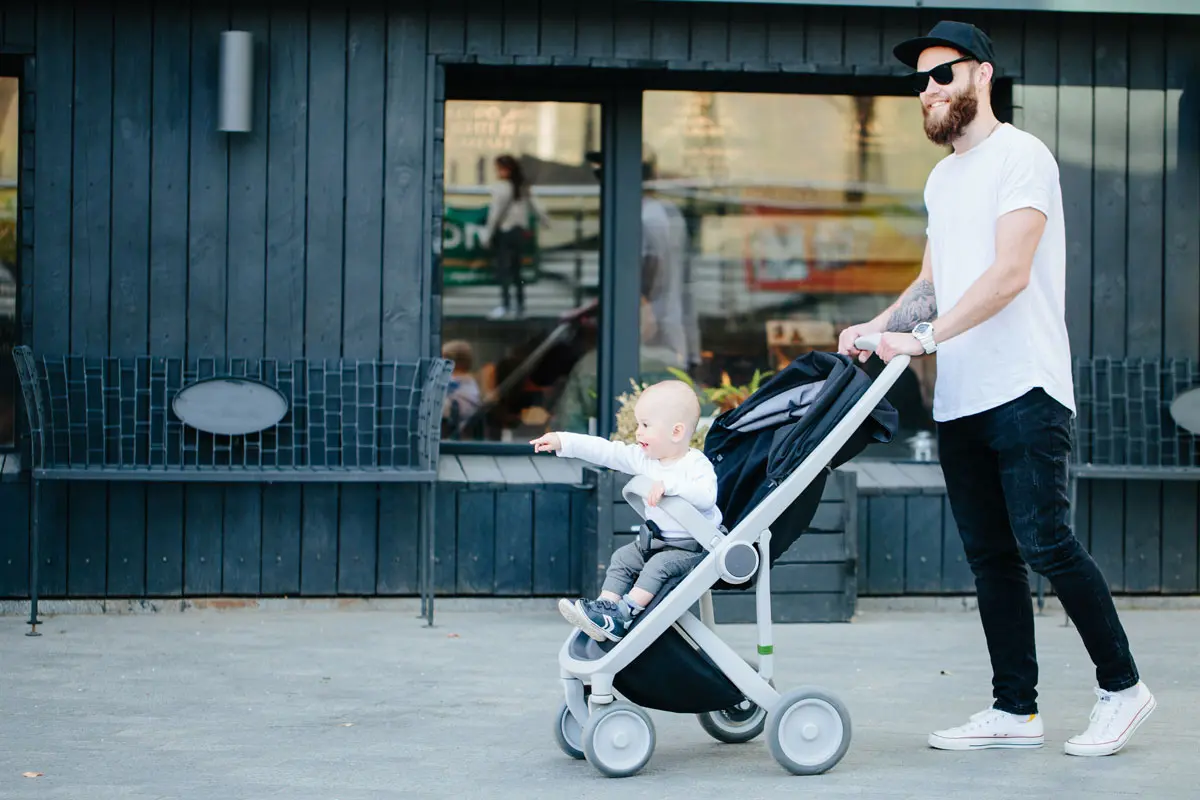 Dad pushing pram